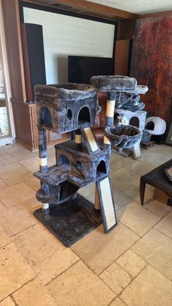 Ultimate cat tree. Cat hammock two cat houses two cat crash pads scratching post , scratching ramps for stretching out.   Your cats will love it.