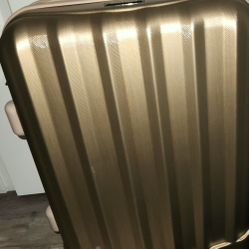 GREAT DEAL..Rockland Gold Colored Eight Wheel Suitcase