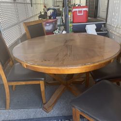 Kitchen table with black leather chairs