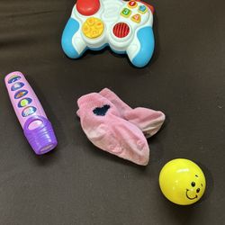 Assorted Baby Toys and Pair of Socks