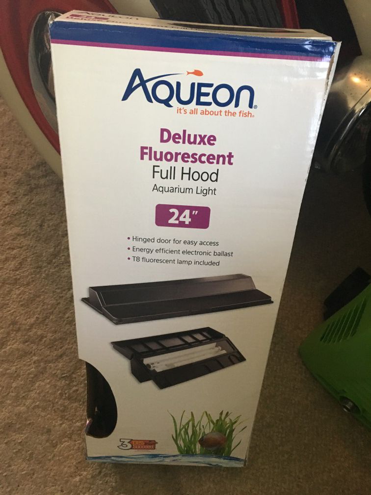 Aqueon hinged fish tank hood light includes T8 fluorescent bulb. Brand new in box never used. 24 inches long.