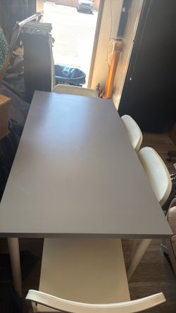 table and 4 plastic chairs