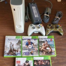 Vintage Microsoft Xbox 360 Refurbished video game system with controller and games