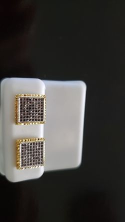Brand new gold plated earrings . Pure silver