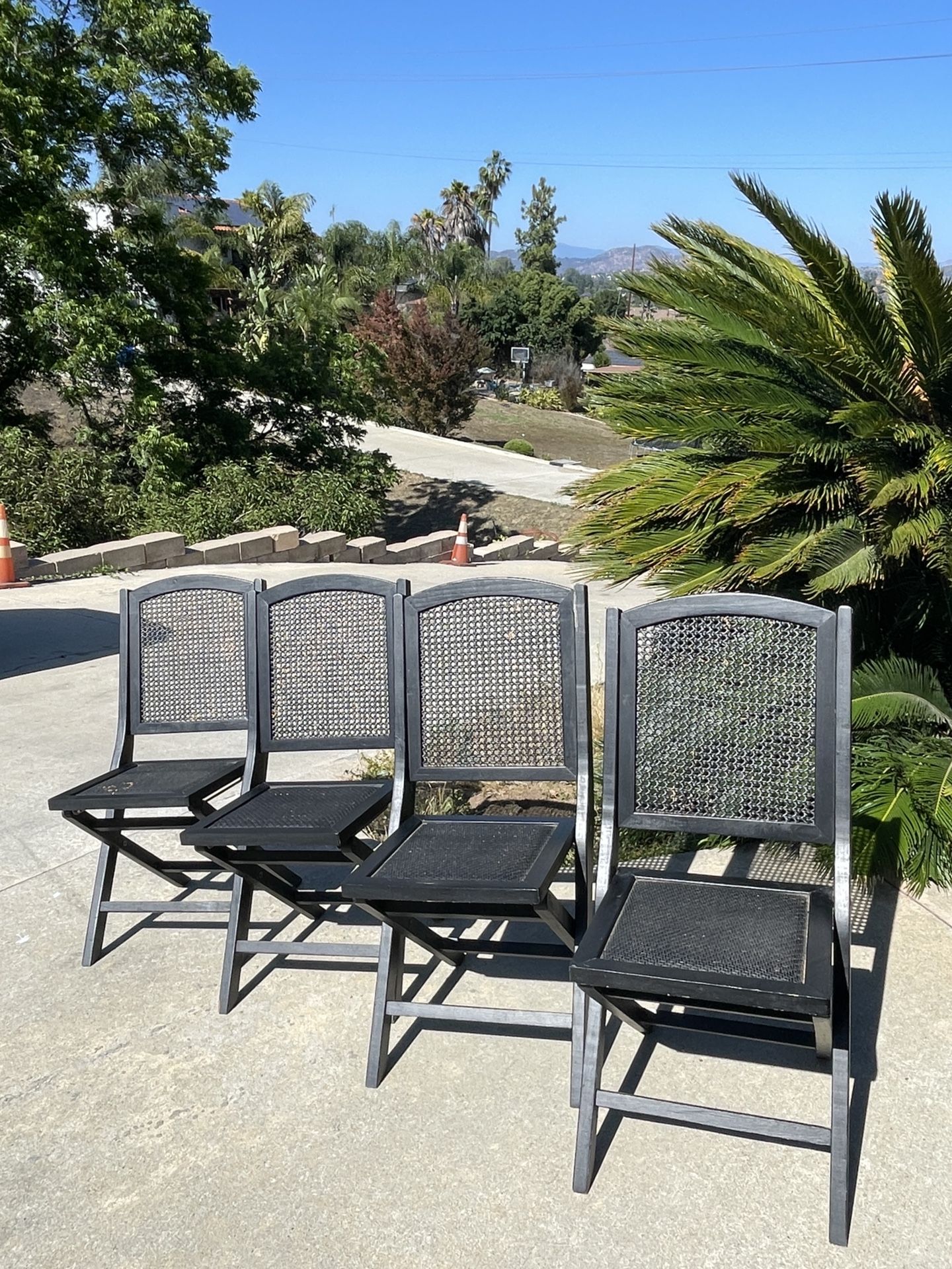 (4) World Market Black Wooden Folding Cane Back & Seat Chairs