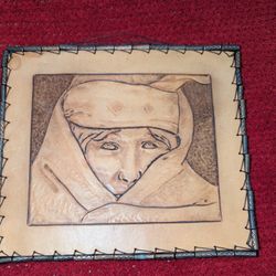 Hand etched/tooled covered face portrait of young Bedouin