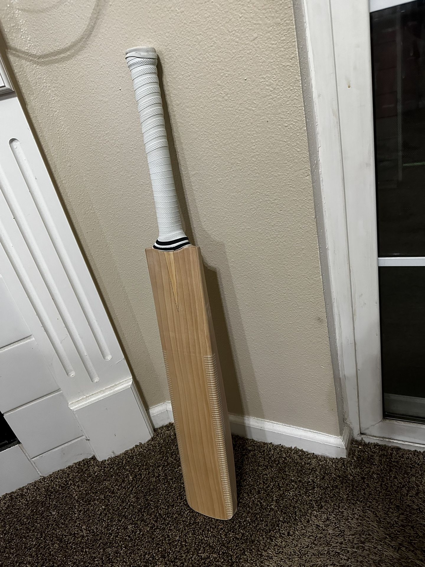 Laver and wood cricket bat