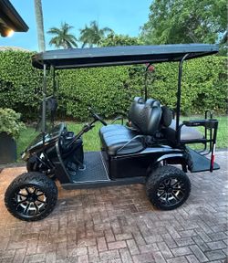 Custom Black 4-Seat Lifted EZGO Golf Cart