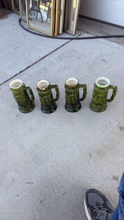Four Piece Antique Beer Stein Set