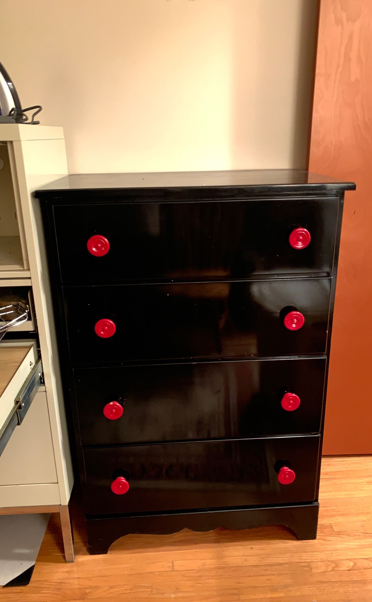 Black dresser with red accents