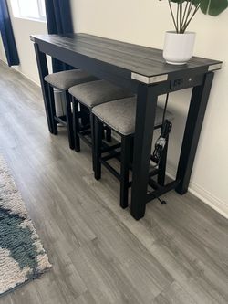 Bar table with barstools