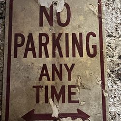 Aged No parking Anytime Sign