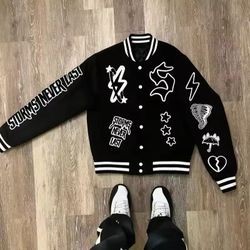 Black & white varsity jacket with embroidered patches and logo