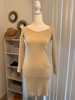 short cream dress with long sleeves.