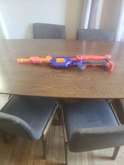 Nerf Gun-size adjustable.  Comes loaded with darts
