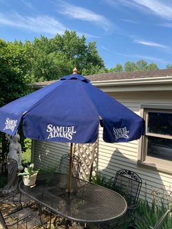 7 FT. Samuel Adam’s patio market shade umbrella with a wooden pole/ good condition,See all pictures posted, pick up in Lake Zürich
