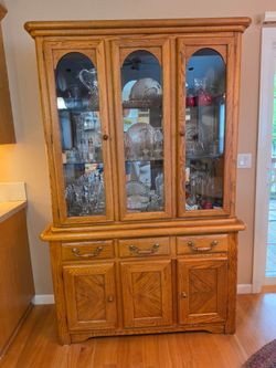 Vintage Solid Oak lighted China Hutch 
Two peices 
52"w