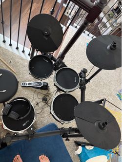 The ONE electronic drum set with headphones