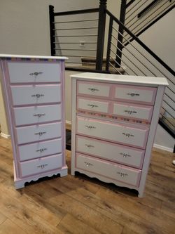 Pink and white dressers
