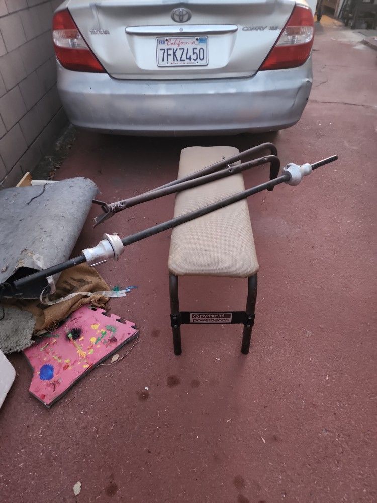 Weight Bench With Weights, Holder Bars, And The Locking Weight Poll.