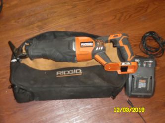 Rigid saw with battery, charger, and bag