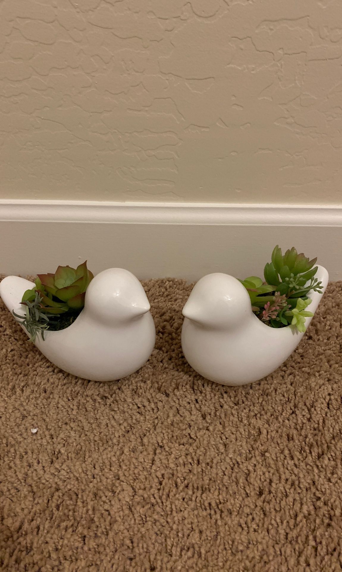 Porcelain birds with fake succulents