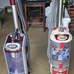 Two SHARK VACUUM 