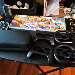 Nintendo Switch With 8 Games 4 Joy-con Chargers 2 Wheels Carry Case Stylus Holder For Games 2 Extra Sets Silicone Overlays
