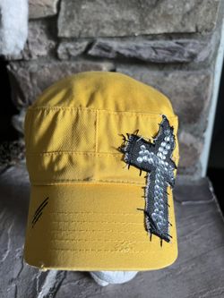 Bright yellow women's military style hat with patchwork cross with rhinestones. Adjustable back.