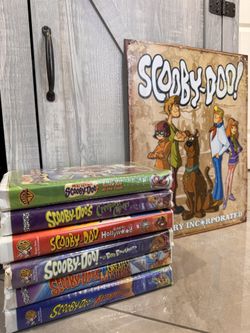 Scooby-doo vhs collection with metal sign