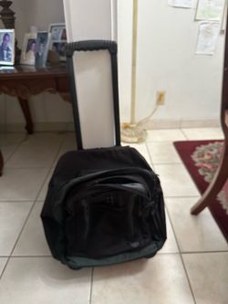 Black backpack with rolling wheels
