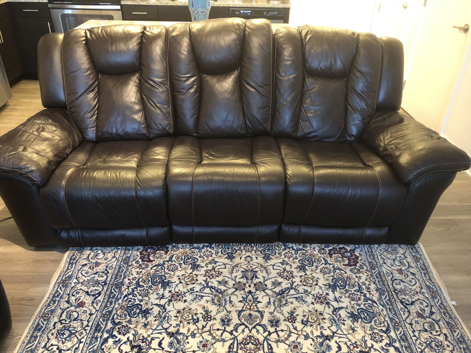 Geniune leather recliner/ dark brown/ pets free smoke free home/ in great condition