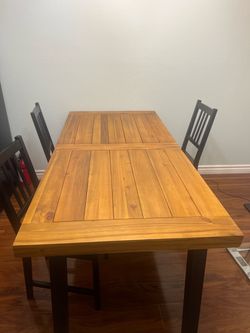 Large dining table with chairs