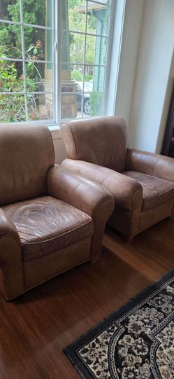 Two Leather Club Chairs
