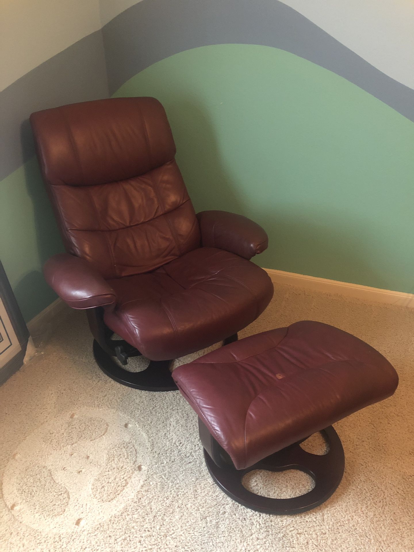 Very Nice burgundy leather chair with foot stool.