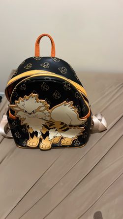 This is a Loungefly Pokemon Arcanine Cosplay Mini Backpack, featuring a prominent applique of Arcanine on the front.The backpack is made from faux lea