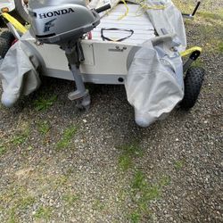 Blowup boat with hard bottom, electric motor or gas motor and trailer