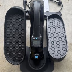 The UKEEP mini elliptical cross trainer (Model UK-3613) is a compact, under-desk exercise machine for low-impact cardio, featuring manual resistance w