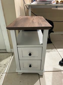 Small nightstand with electrical plugs