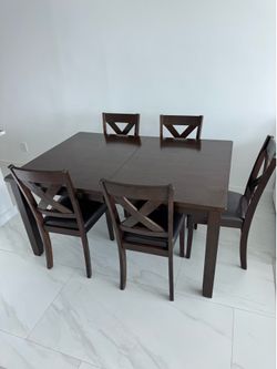 Walnut brown dining room table extension and 5 chairs