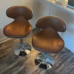 two brown bar stools