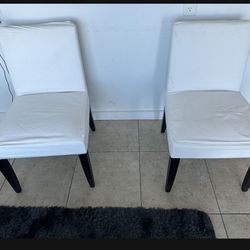 Pair Of White Chairs With Covers