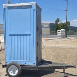 Trailer with portable restroom