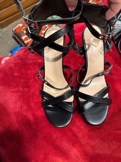 Black high heels with buckle straps