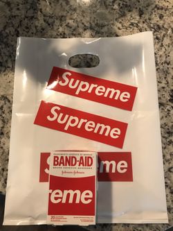 4 boxes of supreme band aids with bag and stickers