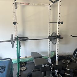 Squat rack with bench and dip bars