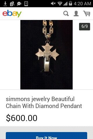 Russell Simmons jewelry co. Stainless steel cross pendant with 11 genuine diamonds in center with chain