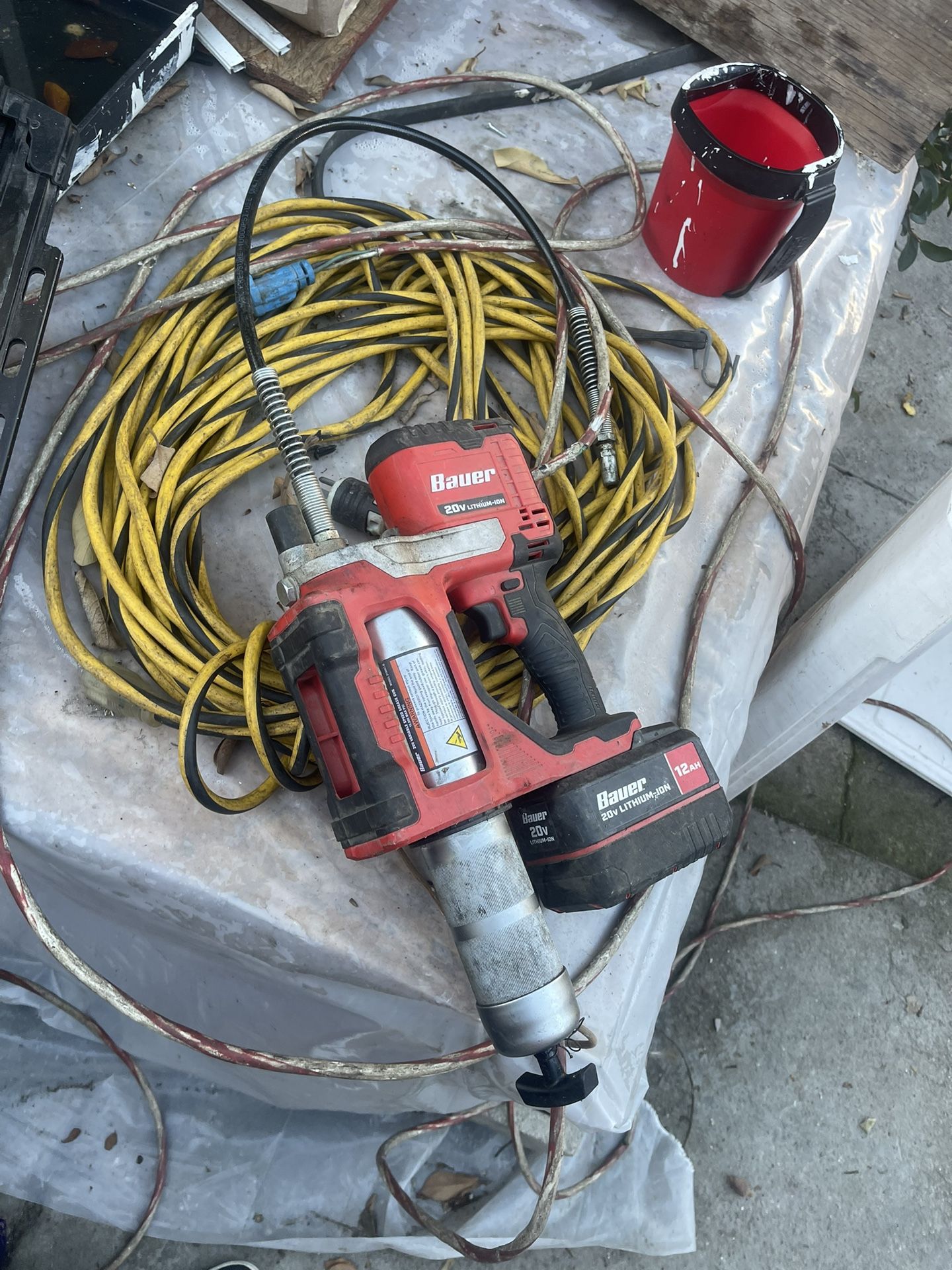 a Bauer 20V cordless grease gun and a 12 Ah high-capacity lithium-ion battery