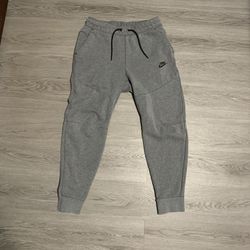 dark grey nike tech pants