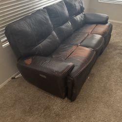 Electronic fold out couch sits three